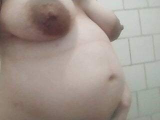 8-months pregnant teen with huge boobs in public shower