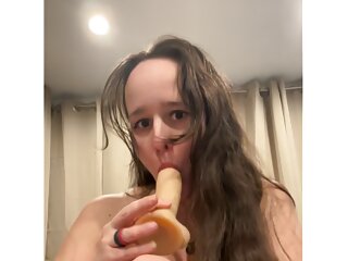 Wife masturbates with her toy cock while talking dirty 
