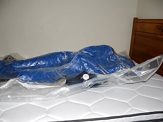 Dec 11 2022 - VacPacked in slvrbrboy1s coveralls in my PVC sleepsack with his shirt &amp; my PVC face shield