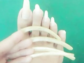Kheora Seong clear long fingernails and toenails