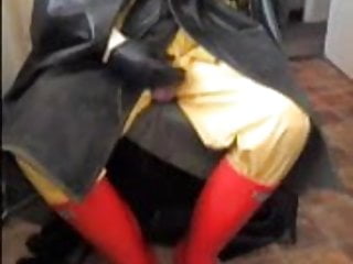 Cock play in rubber cape.