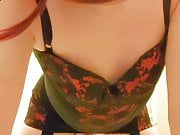 Crossdressing sissy posing in corset and stockings