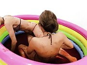 These girls get really naughty when playing in a kiddy pool full with jello