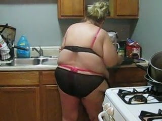 Chubby babe with huge melons playing in the kitchen