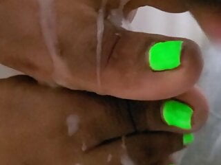 Cream on bright green ebony toes...