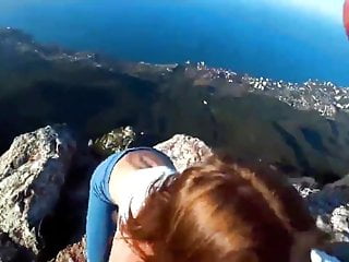 Risky public sex on a cliff...