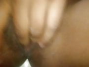 Young slim ebony MILF fingering and slapping her pussy