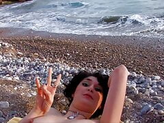 brunette with natural tits has anal sex by the sea