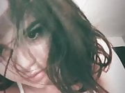 Selena Gomez selfie with nice cleavage, listing to Nirvana