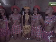 Topless African girls prepare for ritual dance