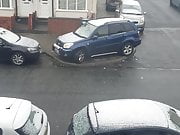 Naked girl has sex in the snow behind the car 