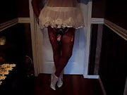 Sissy dolled up in pink chastity cage
