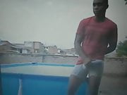 black guy on roof rubbing his huge bulge