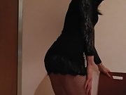 Crossdresser in black dress posing