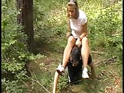 melady riding her horse in forest