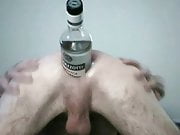 Huge bottle inside his asshole