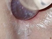 Close-up of creamy pussy and anal with glass dildo