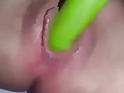 masturbates with a green dildo