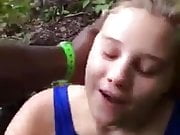 Hot woman sucking a BBC in the woods.