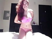 Busty redhead showing off her goods