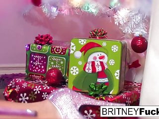 Britney finds a Christmas gift under the tree perfectly
