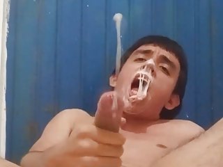 Latino gay jerking off while chewing...