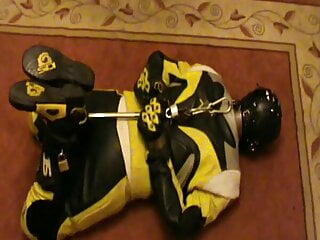 Yellow and black bikerslave is hogshackled...