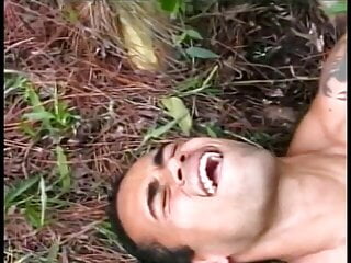 Young Latino Gets Drilled By A Gay Stud Lying On A Tree Trun
