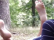 blonde showing feet in nature