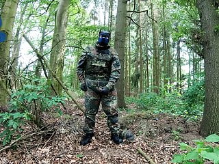 Soldier Pup Pawing Off In The Woods