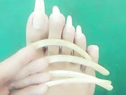 Kheora Seong clear long fingernails and toenails