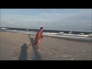Football jock on the beach